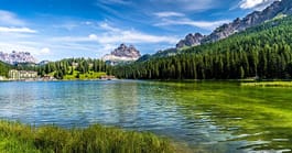 Gorgeous stock photo of river bordered by a mountain chain