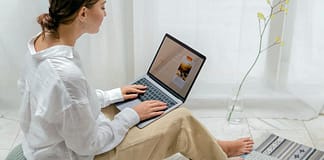 woman sitting with laptop designing her blog - From Zero To Blog in 5 steps