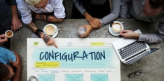 Overhead view of employees around a Configuration design chart - setting up WordPress
