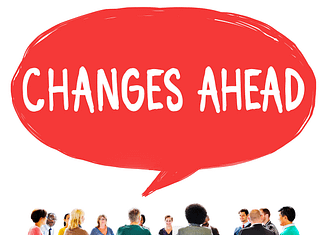 Round table of people with a callout "Changes Ahead" - Overcome Your Fear Of Change
