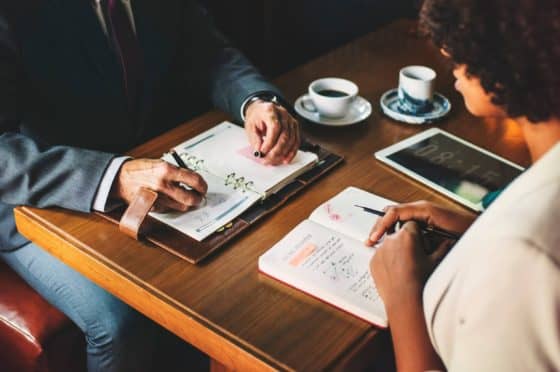 Manager sitting across from employee in a One On One meeting - Perceived an effective leader