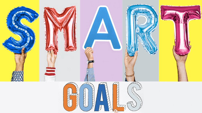 SMART Goals letters held by hands