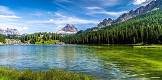 Gorgeous stock photo of river bordered by a mountain chain