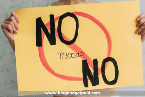 Learn to say no to disruptions and low-impact activities. Woman is holding a sign that says "No means No"