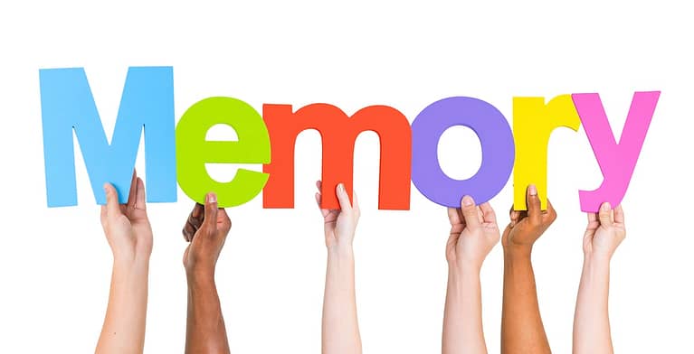 Letters Memory held up by hands - Top 5 Reasons People Should Read Daily