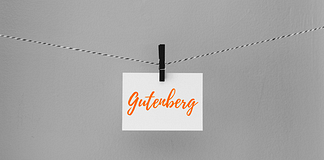 Grey background with white post it note with "Gutenberg" on it