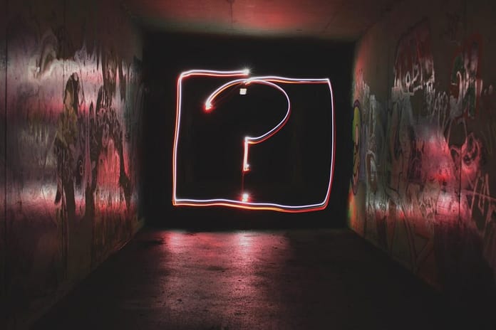 question mark in a darkish room - Have You Figured Out What Your "WHY" Is Yet?